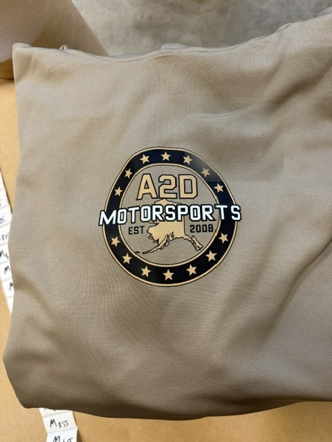 A2D Motorsports sand hoodie with the gold Stars and State Alaska logo