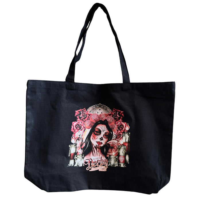 Black tote bag with a colorful design of a woman's face and roses on a white background