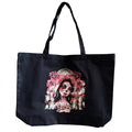 Black tote bag with a colorful design of a woman's face and roses on a white background
