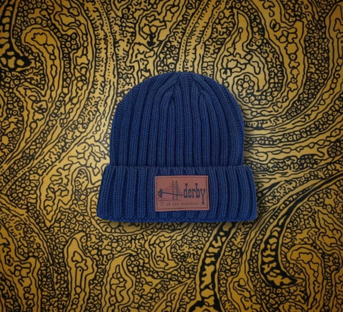 Navy ribbed beanie with leather logo patch